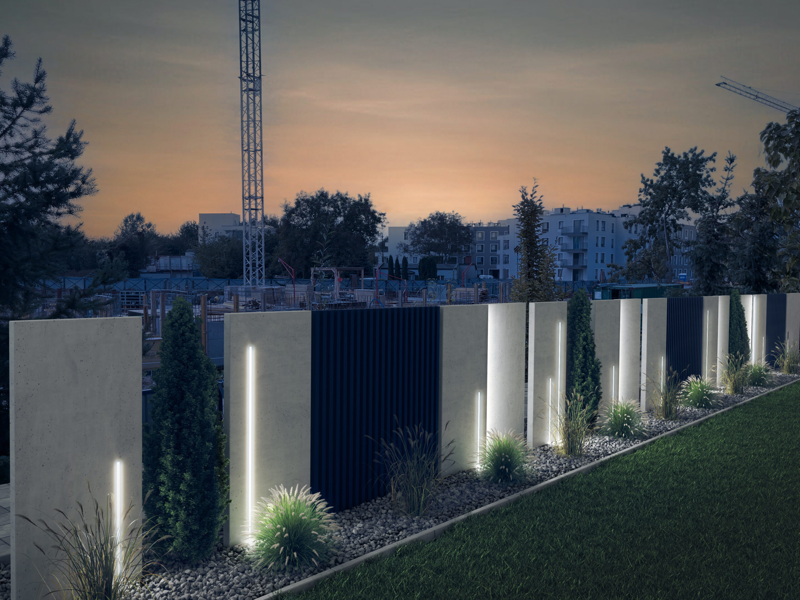 Podświetlone ogrodzenie betonowe, w tle znajduje się widok na miasto